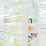 Modern new white drugstore pharmacy without clients visitors customers with shelves full of drugs